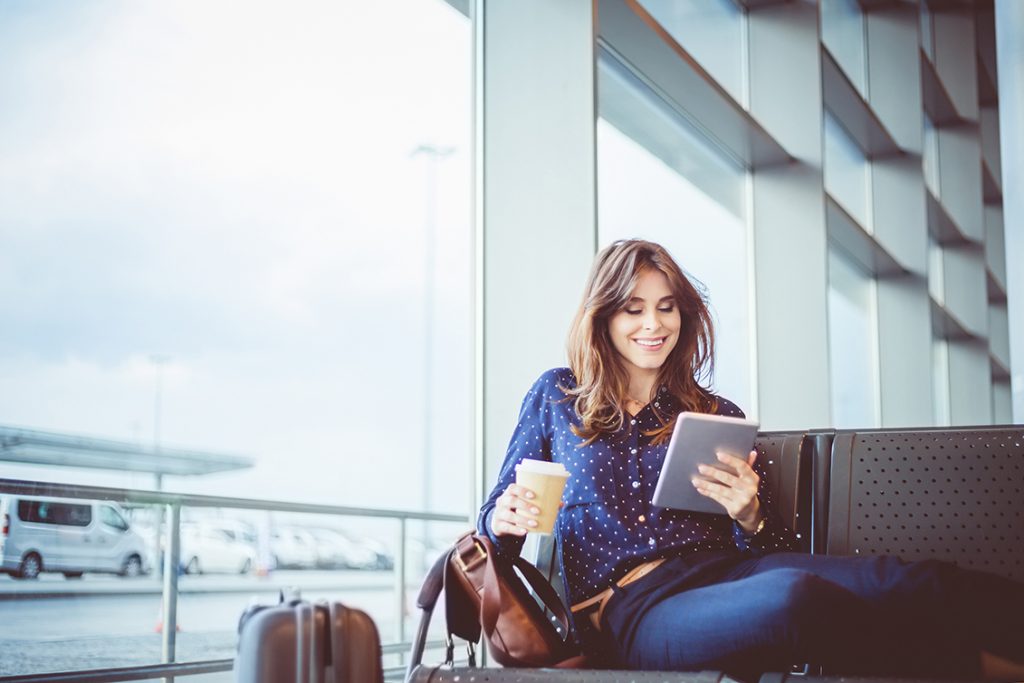 Smiling woman lounging at the airport