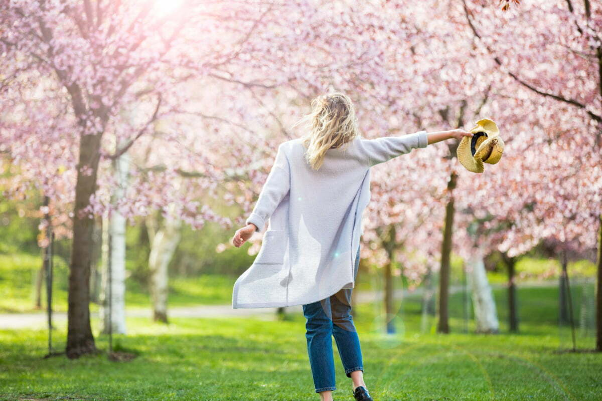 Happy Woman in the Park in the Springtime