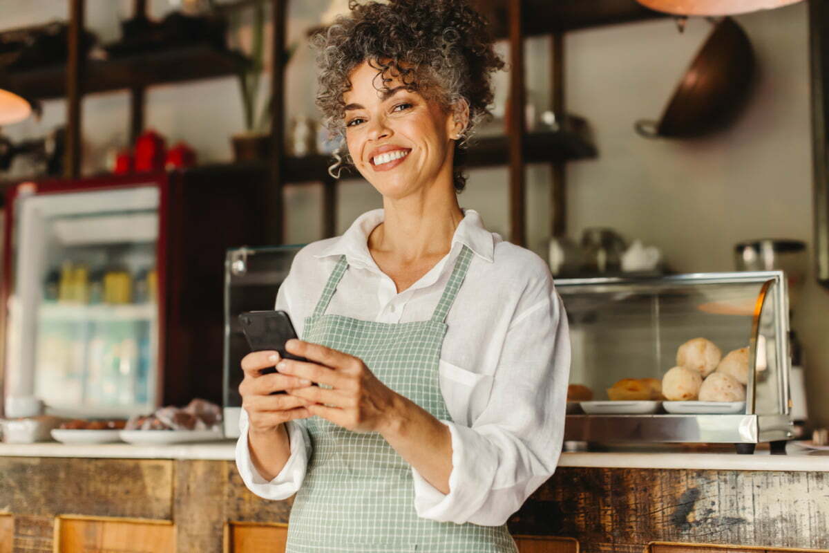 Woman running her own business on her phone