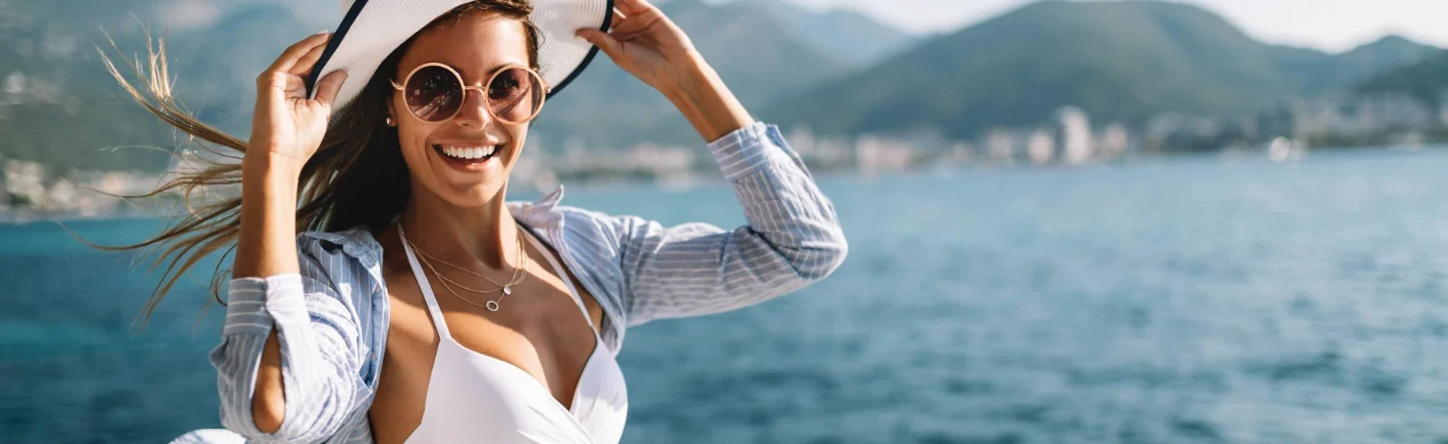 beautiful happy woman wearing swimsuit on a boat