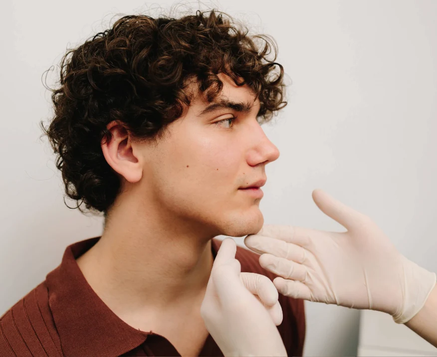 Young man at consultation for dermal filler to the chin