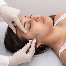 woman getting dermaplaning treatment