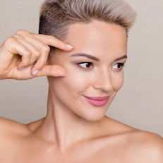 beautiful woman touching eyelid