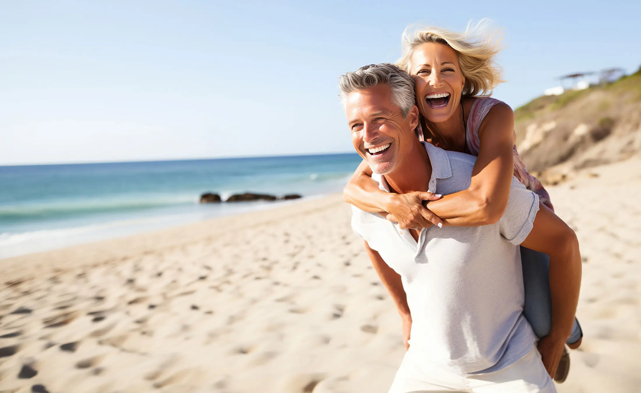 couple on beach smiling