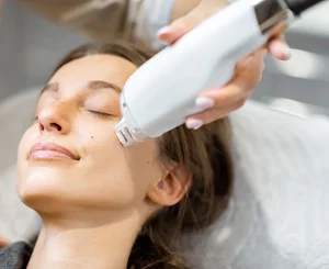 woman receiving microneedling treatment