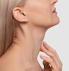 side profile of mature woman touching her neck
