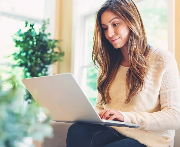 woman researching on laptop