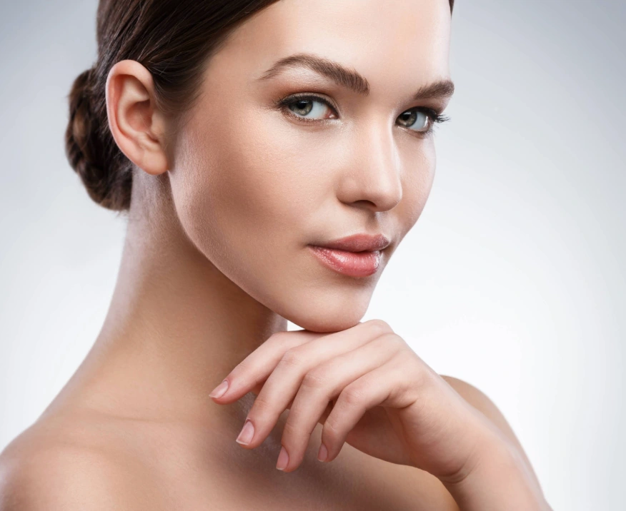 confident middle-aged woman showcasing smooth and flawless skin