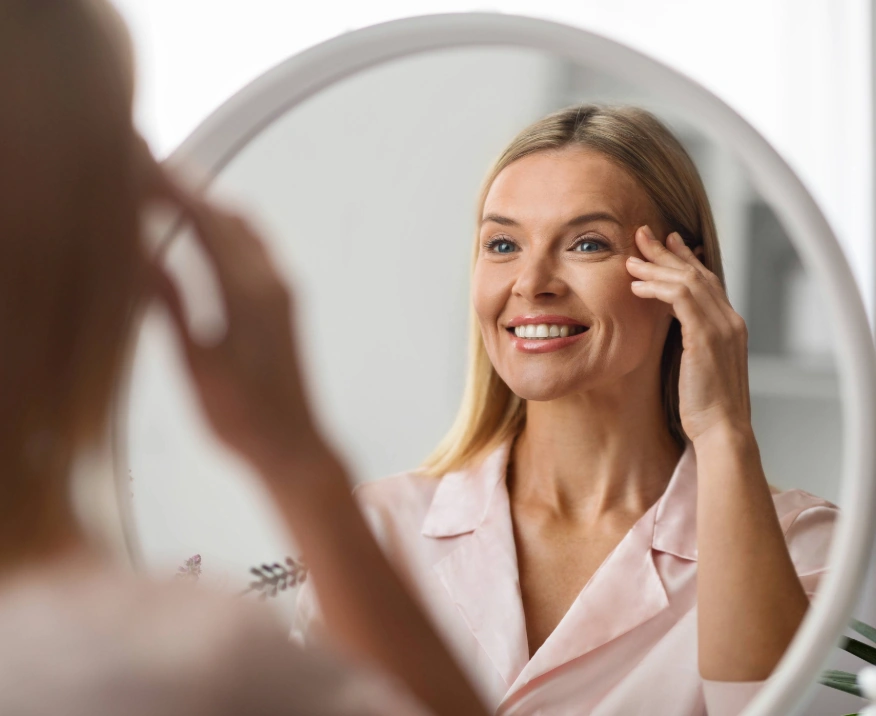 middle-aged woman looking in the mirror