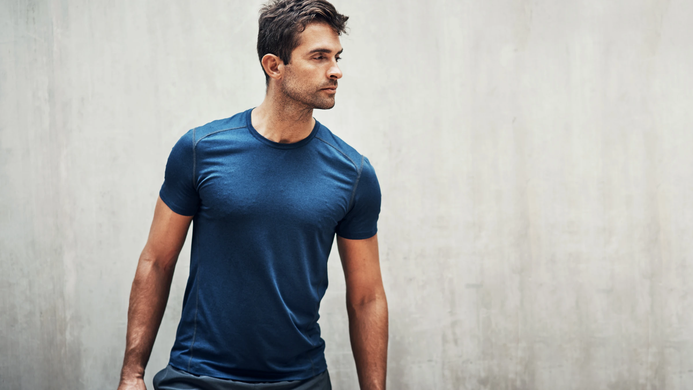 confident man in athletic shirt