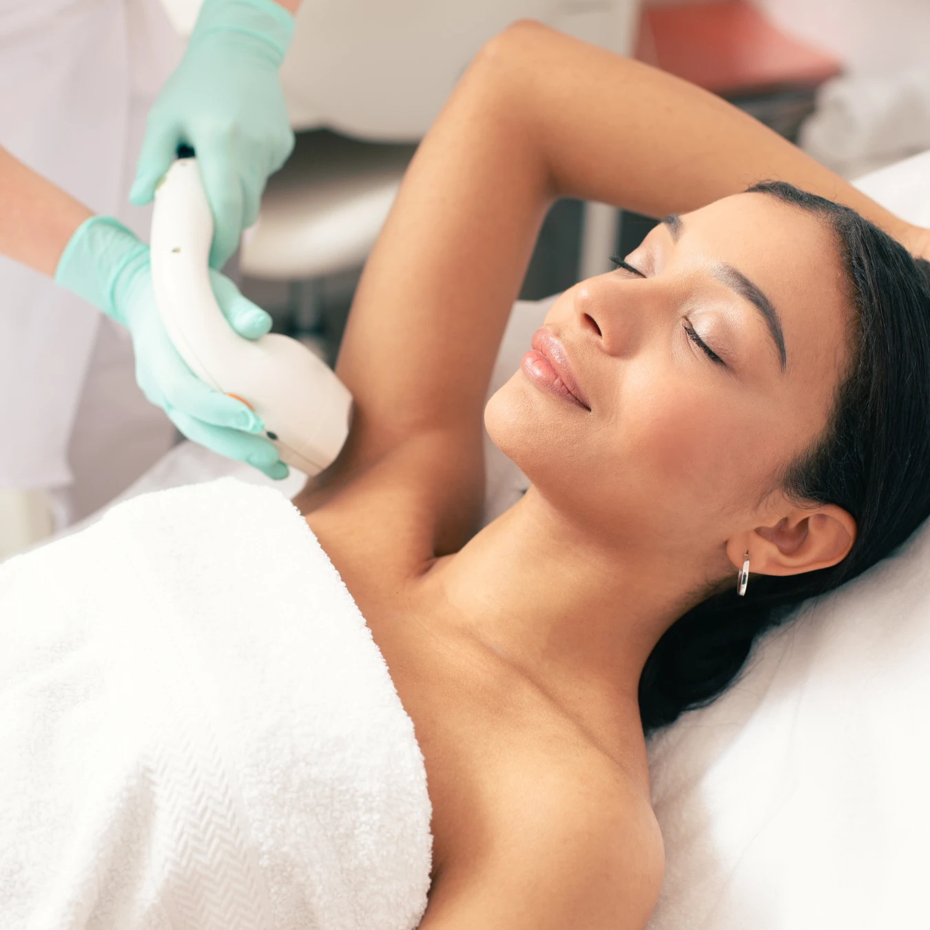 Woman getting underarm laser hair reduction