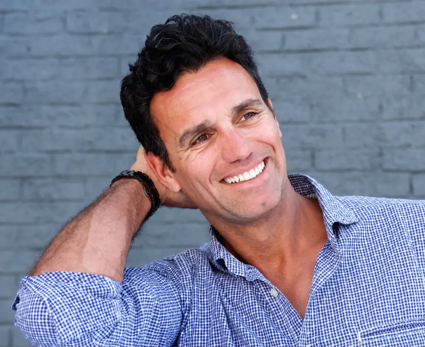 attractive middle-aged man smiling with clear skin