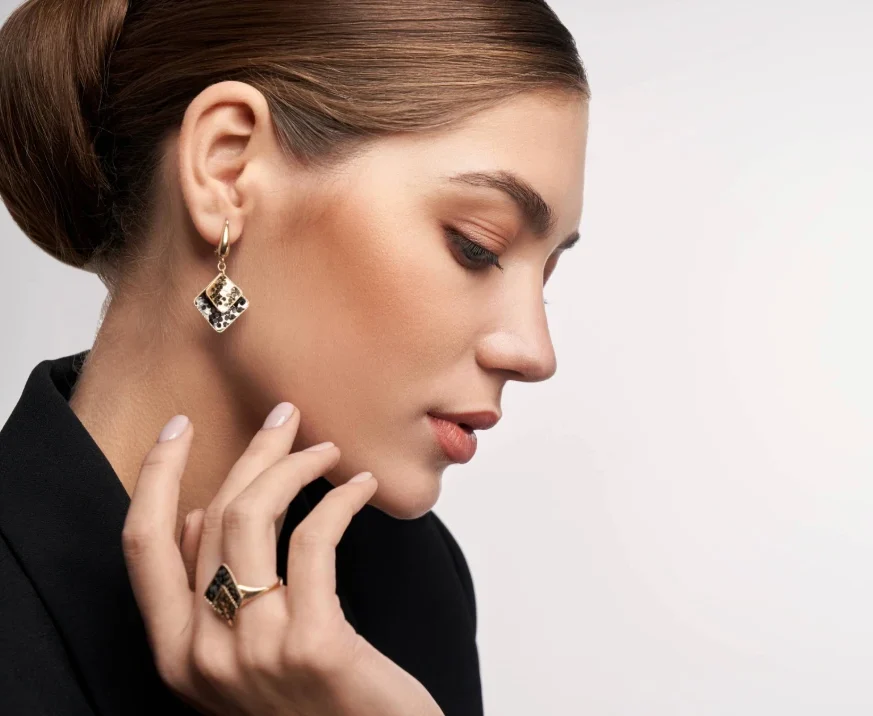 elegant woman showcasing symmetrical ear with earings