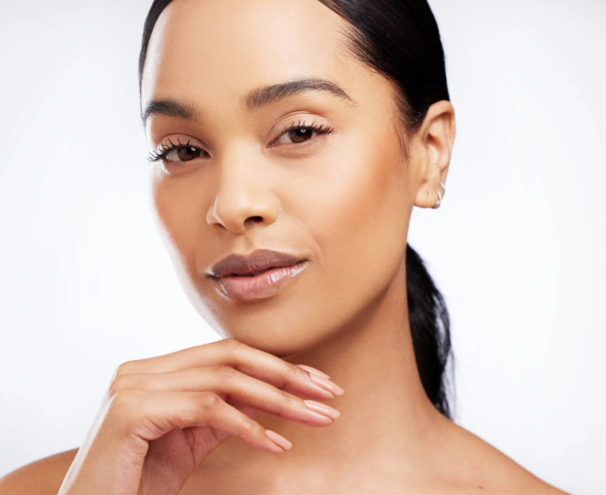 gorgeous woman touching face with smooth skin