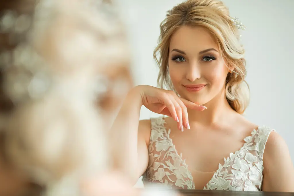 beautiful bride smiling in mirror